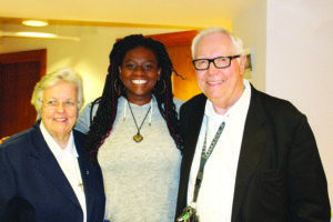 AACS president Tanaya Reed alongside Sister Cathy Nally, IHM and Joseph Healey, Ph.L.