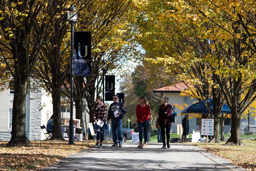 A family walking on Immaculata University campus