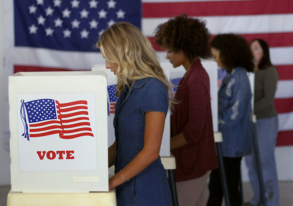 People casting votes at polling place