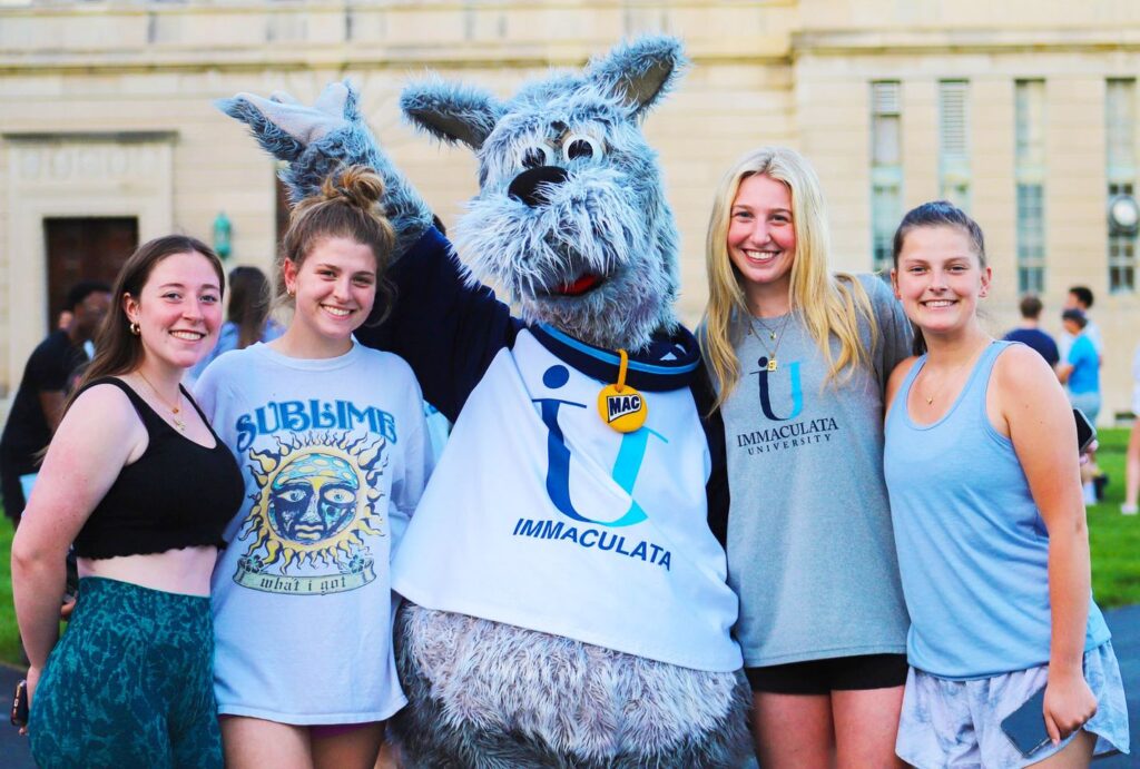 Mac on back campus with Immaculata students