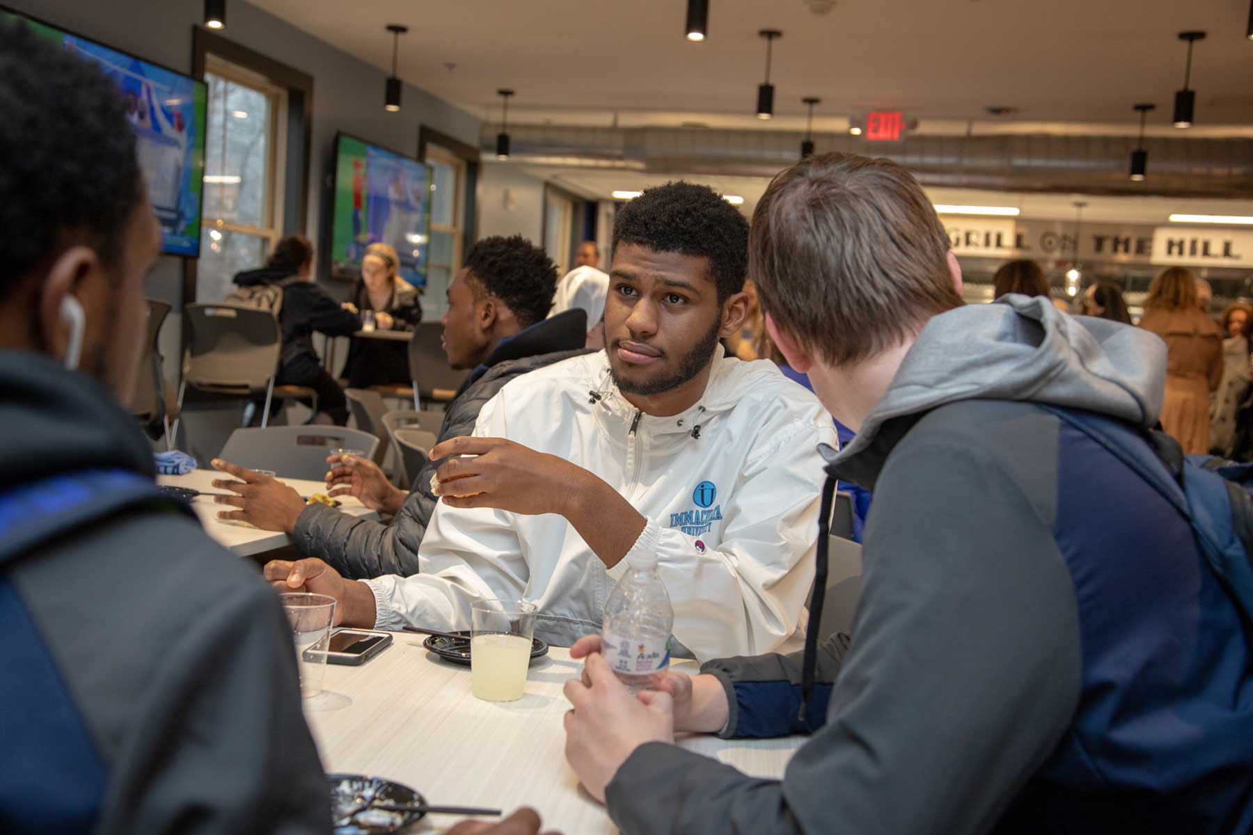 Students sitting at table talking