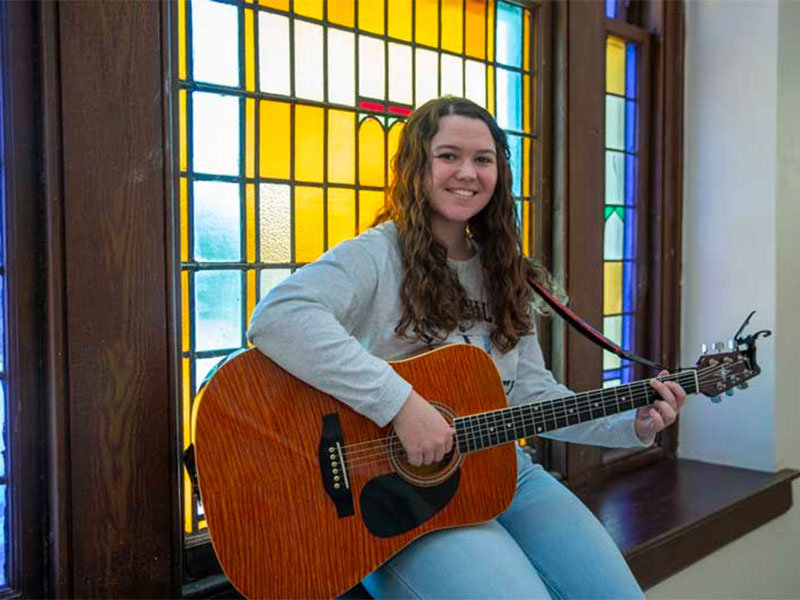 Young woman playing a guitar