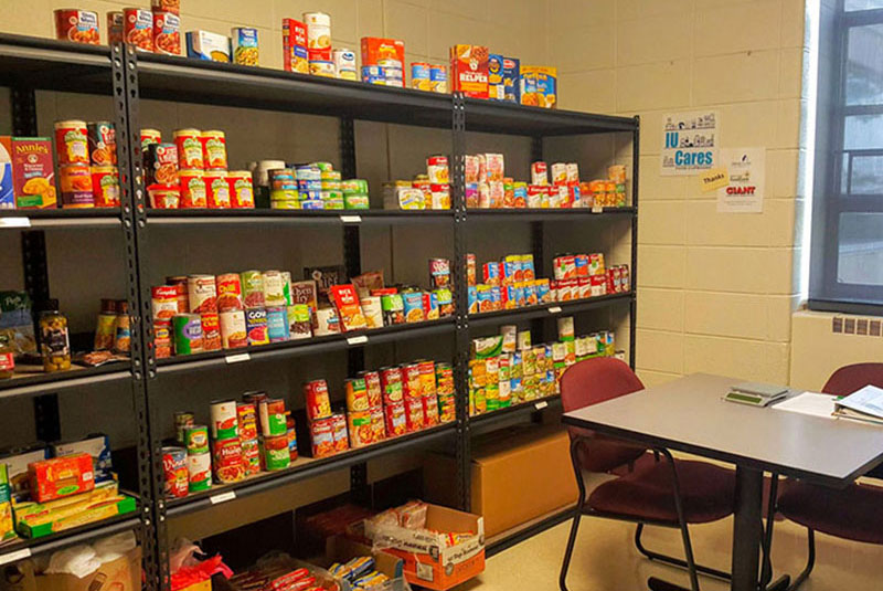 Cans and boxes of food on shelves