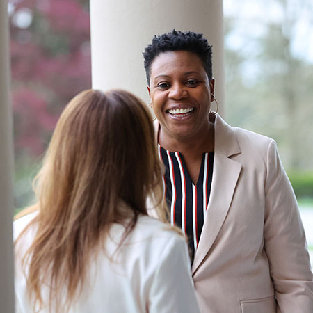 Graduate students at Immaculata University speaking to each other