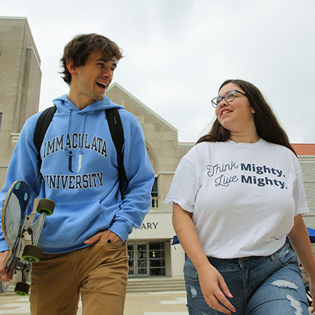 Immaculata University Traditional Undergraduate Studies - 2 students talking walking to class