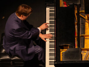 Overhead view of man playing piano