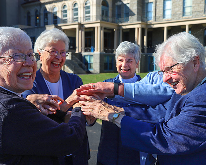 Group of IHM sisters on college campus