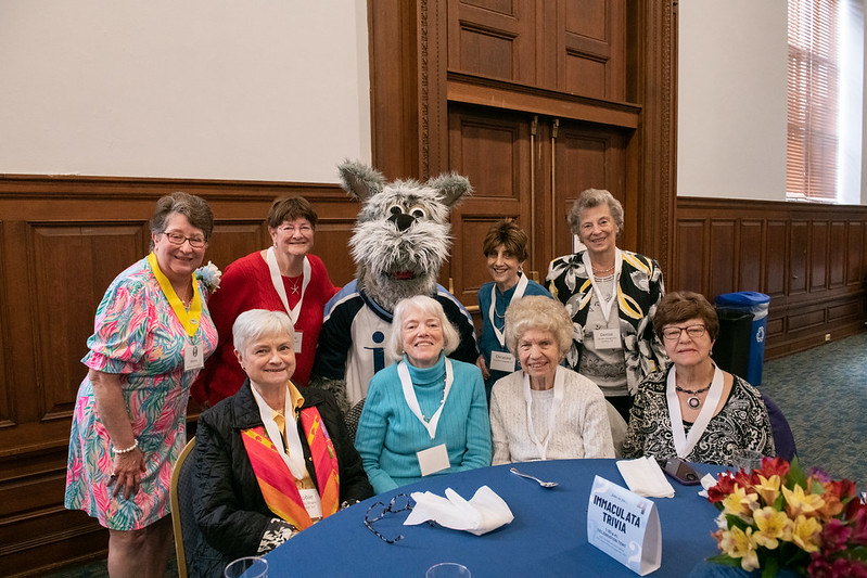 Women at table with mascot