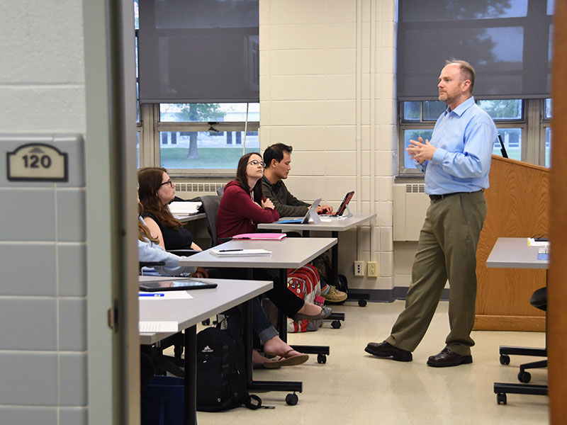 Professor in front of college class