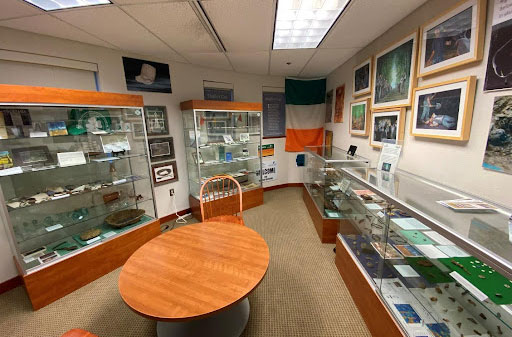 A table and display cases in the library