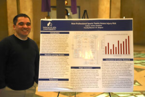 College student in front of research poster