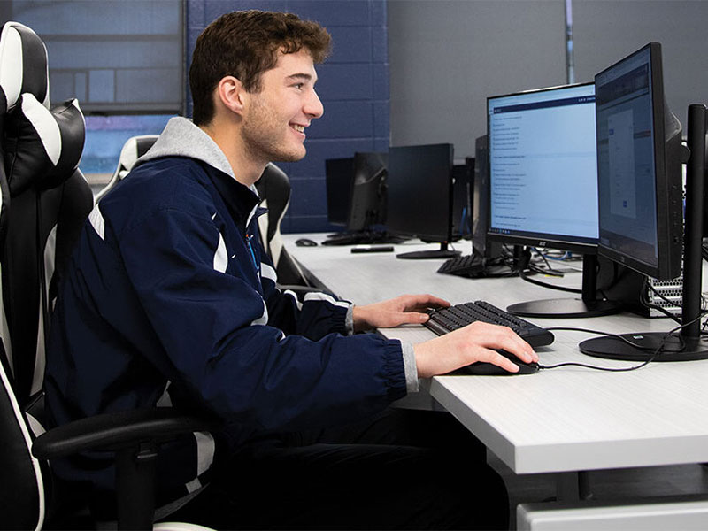 Young man working in computer lab