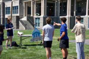 Two young men tossing a ring