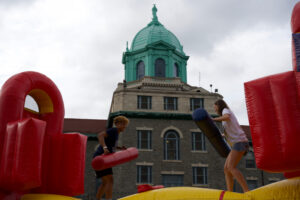 Two people on a large inflatable object