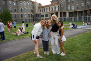 Four young women smiling for the camera