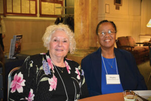 Two women sitting at table
