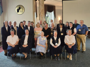 A group of older college professors and nuns