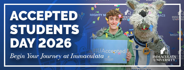 Mascot and young man holding sign "IU Accepted"