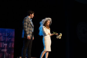 Actors on stage in costume (man and woman)