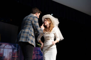 Actors on stage in costume (man and woman)