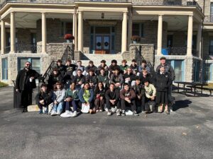 Group of high school students in front of college building