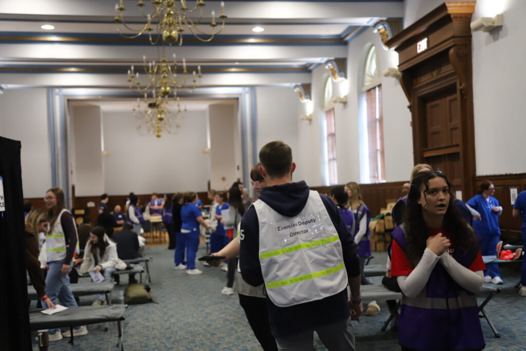 In the Great Hall at Immaculata University, emergency planning and management students and members of Immaculata’s Red Cross Club coordinated an emergency congregate shelter.