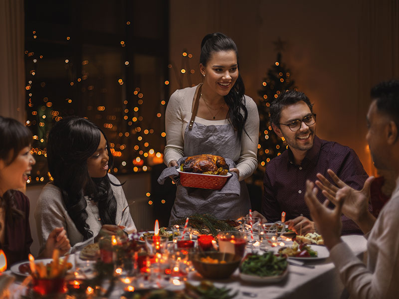 Group of people around a holiday table
