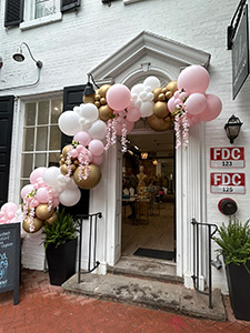 Storefront door decorated with balloons