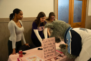 Mascot pretending to sign up for club