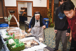 Nun organizing food at event