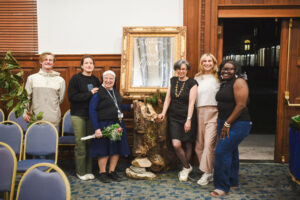 Group of people posing for camera